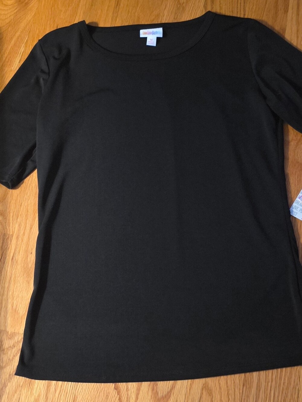 LuLaRoe Gigi top in solid black with elbow-length sleeves Nwt Medium